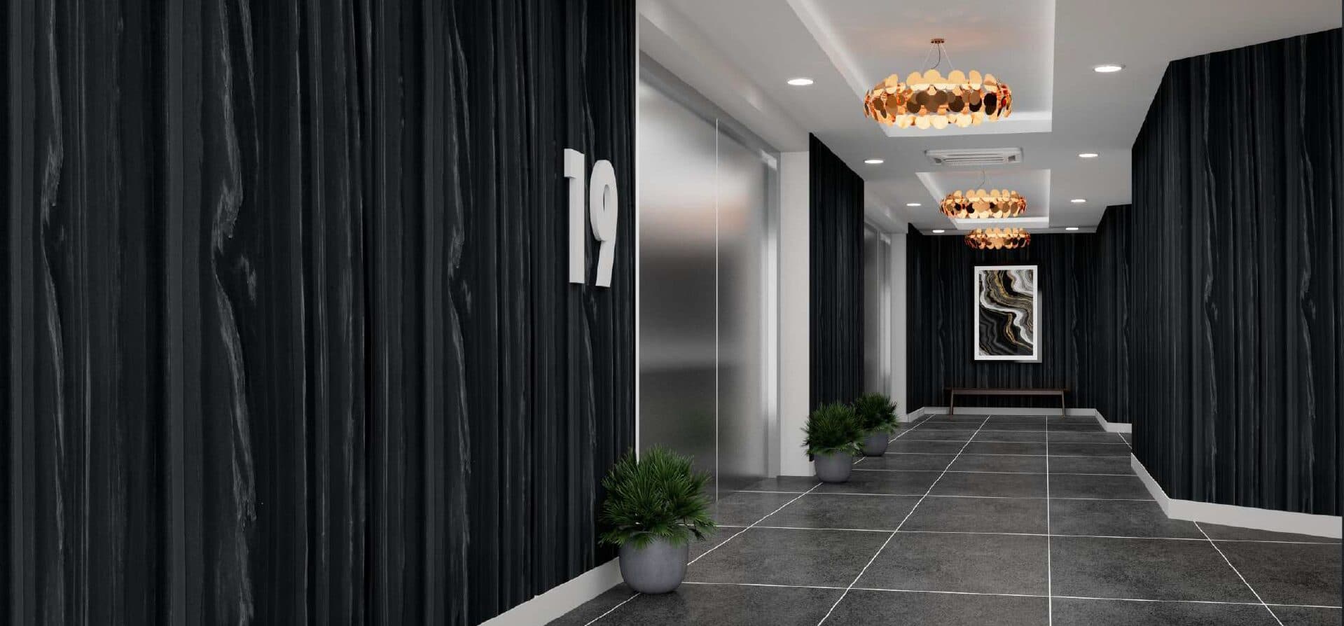 Dark residential lobby corridor lined in a stone-print acoustic panel