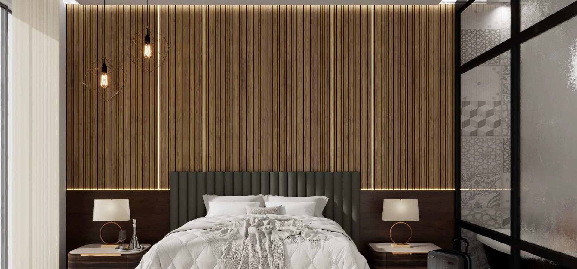 Hotel suite with a full-height timber slat acoustic wall behind the bed